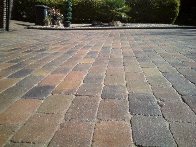 Clean block-paved driveway with restored colour after professional patio and driveway cleaning